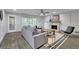Cozy living room with a decorative fireplace, modern furniture, and access to the backyard at 5400 Mill Run Dr, Marietta, GA 30068