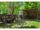 This backyard features a shed, covered area with seating, and a well-maintained lawn at 1734 8Th St, Atlanta, GA 30341