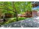 Expansive backyard with well-kept lawn, screened-in porch, fire pit, and shed at 1734 8Th St, Atlanta, GA 30341