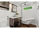 Charming bathroom featuring a clawfoot tub, dark-stained vanity, and industrial-style shower fixture at 1734 8Th St, Atlanta, GA 30341