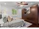 Comfortable bedroom featuring hardwood floors, a ceiling fan, and a wardrobe closet at 1734 8Th St, Atlanta, GA 30341