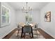 Elegant dining room with modern chandelier, hardwood floors, and views to the living room at 1734 8Th St, Atlanta, GA 30341