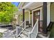 Cozy front porch with stylish seating, decorative railings, and a craftsman-style front door at 1734 8Th St, Atlanta, GA 30341