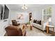 Well-lit living room with modern furniture, hardwood floors, and a cozy atmosphere with wall art at 1734 8Th St, Atlanta, GA 30341