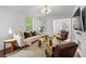 Stylish living room featuring hardwood floors, recessed lighting, and comfortable sofa seating near a window at 1734 8Th St, Atlanta, GA 30341