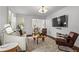 Bright living room with hardwood floors, modern lighting, comfortable seating, and a view into the dining area at 1734 8Th St, Atlanta, GA 30341