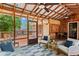 Spacious screened porch with outdoor seating, ceiling fans, and a view of the backyard at 1734 8Th St, Atlanta, GA 30341