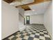 Unfinished basement with checkered tile floor and access to stairs at 2024 Lower Burris Road Rd, Canton, GA 30114