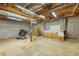 Unfinished basement with block walls and exposed ceiling, providing ample storage or expansion potential at 2024 Lower Burris Road Rd, Canton, GA 30114