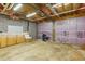 Unfinished basement with block walls and exposed ceiling, providing ample storage or expansion potential at 2024 Lower Burris Road Rd, Canton, GA 30114