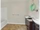 Bright bathroom features a double vanity, tub and shower, and decorative mirrors at 2024 Lower Burris Road Rd, Canton, GA 30114