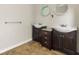 Bright bathroom features a double vanity, decorative mirrors, tile floor, and neutral paint at 2024 Lower Burris Road Rd, Canton, GA 30114