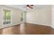Spacious bedroom with hardwood floors, natural light, and a ceiling fan at 2024 Lower Burris Road Rd, Canton, GA 30114
