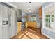 Bright kitchen with stainless steel appliances, wooden cabinets, and plenty of counter space at 2024 Lower Burris Road Rd, Canton, GA 30114