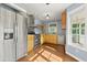 Well-lit kitchen featuring modern appliances, ample counter space, and wooden cabinetry at 2024 Lower Burris Road Rd, Canton, GA 30114