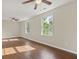 Spacious living room featuring hardwood floors and ample natural light from two windows at 2024 Lower Burris Road Rd, Canton, GA 30114