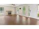 Bright living room with hardwood floors, fireplace, and large windows, offering natural light at 2024 Lower Burris Road Rd, Canton, GA 30114