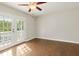 Bright living room with hardwood floors and access to the deck through French doors at 2024 Lower Burris Road Rd, Canton, GA 30114