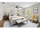 Bright and airy main bedroom featuring hardwood floors, ceiling fan, neutral colors, and ample natural light at 2024 Lower Burris Road Rd, Canton, GA 30114