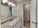 Bathroom featuring granite countertops and a well-lit vanity mirror at 2041 Kramer Way, Marietta, GA 30062