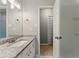 Well-lit bathroom with a granite countertop vanity, updated fixtures, and a separate shower room for a fresh and modern feel at 2041 Kramer Way, Marietta, GA 30062