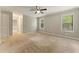 Spacious bedroom featuring neutral paint, natural light, and a ceiling fan, offering a relaxing retreat at 2041 Kramer Way, Marietta, GA 30062
