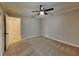 Neutral bedroom featuring ceiling fan, carpet, and a closet at 2041 Kramer Way, Marietta, GA 30062