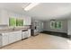 Open-concept kitchen with stainless steel appliances, granite counters, and a seamless transition to the adjacent living area at 2041 Kramer Way, Marietta, GA 30062