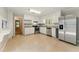 Modern kitchen featuring stainless steel appliances, granite countertops, and ample storage with sleek white cabinetry at 2041 Kramer Way, Marietta, GA 30062