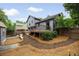 Beautiful backyard with an elevated wooden deck, fresh pine straw, and manicured landscaping, perfect for outdoor living at 2872 Estuary Dr, Acworth, GA 30101