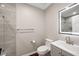 Modern bathroom with a stylish vanity, lighted mirror, glass shower, and tile accents, offering a sleek design at 2872 Estuary Dr, Acworth, GA 30101