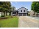 Charming gray two-story home featuring a well-manicured front yard and a two-car garage at 2872 Estuary Dr, Acworth, GA 30101