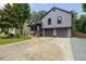 Charming gray two-story home featuring a well-manicured front yard and a two-car garage at 2872 Estuary Dr, Acworth, GA 30101
