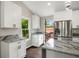 Modern kitchen with white cabinetry, granite countertops, stainless steel appliances, and a large island at 2872 Estuary Dr, Acworth, GA 30101