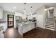 Modern kitchen with white cabinetry, granite countertops, stainless steel appliances, and a large island at 2872 Estuary Dr, Acworth, GA 30101