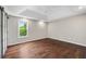 Tranquil main bedroom with hardwood floors, tray ceiling, and ample natural light at 2872 Estuary Dr, Acworth, GA 30101
