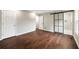 Large main bedroom with dark wood floors, barn door to the bathroom, and plenty of closet space at 2872 Estuary Dr, Acworth, GA 30101