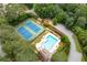 Aerial shot of a neighborhood pool, tennis courts, and clubhouse at 3361 Woodington Se Ct, Marietta, GA 30067