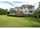 Exterior view of home with large backyard, deck, and screened porch at 3361 Woodington Se Ct, Marietta, GA 30067