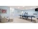 Finished basement presents a rec area and exercise equipment in a comfortable layout at 3361 Woodington Se Ct, Marietta, GA 30067