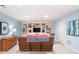 Finished basement featuring built-in shelving and comfortable seating area with light blue colored walls at 3361 Woodington Se Ct, Marietta, GA 30067