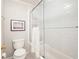Bright bathroom showcasing a bathtub with glass doors and white subway tile surround at 3361 Woodington Se Ct, Marietta, GA 30067