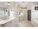 Spacious bathroom boasts custom vanities, tiled floors, and a glass-enclosed shower at 3361 Woodington Se Ct, Marietta, GA 30067