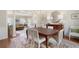 Elegant dining room with hardwood floors and decorative rug is perfect for Gathering meals and entertaining guests at 3361 Woodington Se Ct, Marietta, GA 30067
