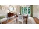 Elegant dining room with hardwood floors, chandelier, and wainscoting at 3361 Woodington Se Ct, Marietta, GA 30067
