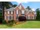 Beautiful brick home with manicured lawn and mature landscaping offers classic curb appeal at 3361 Woodington Se Ct, Marietta, GA 30067