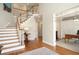Inviting foyer with hardwood floors, staircase, and view to an office at 3361 Woodington Se Ct, Marietta, GA 30067