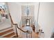 Grand foyer with a chandelier and hardwood floors viewed from the 2nd floor at 3361 Woodington Se Ct, Marietta, GA 30067