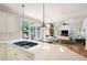 Bright kitchen with eat-in bar, view to dining, living and outdoor areas at 3361 Woodington Se Ct, Marietta, GA 30067