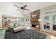 Cozy living room with a stone fireplace, lots of windows, and access to a screened porch at 3361 Woodington Se Ct, Marietta, GA 30067
